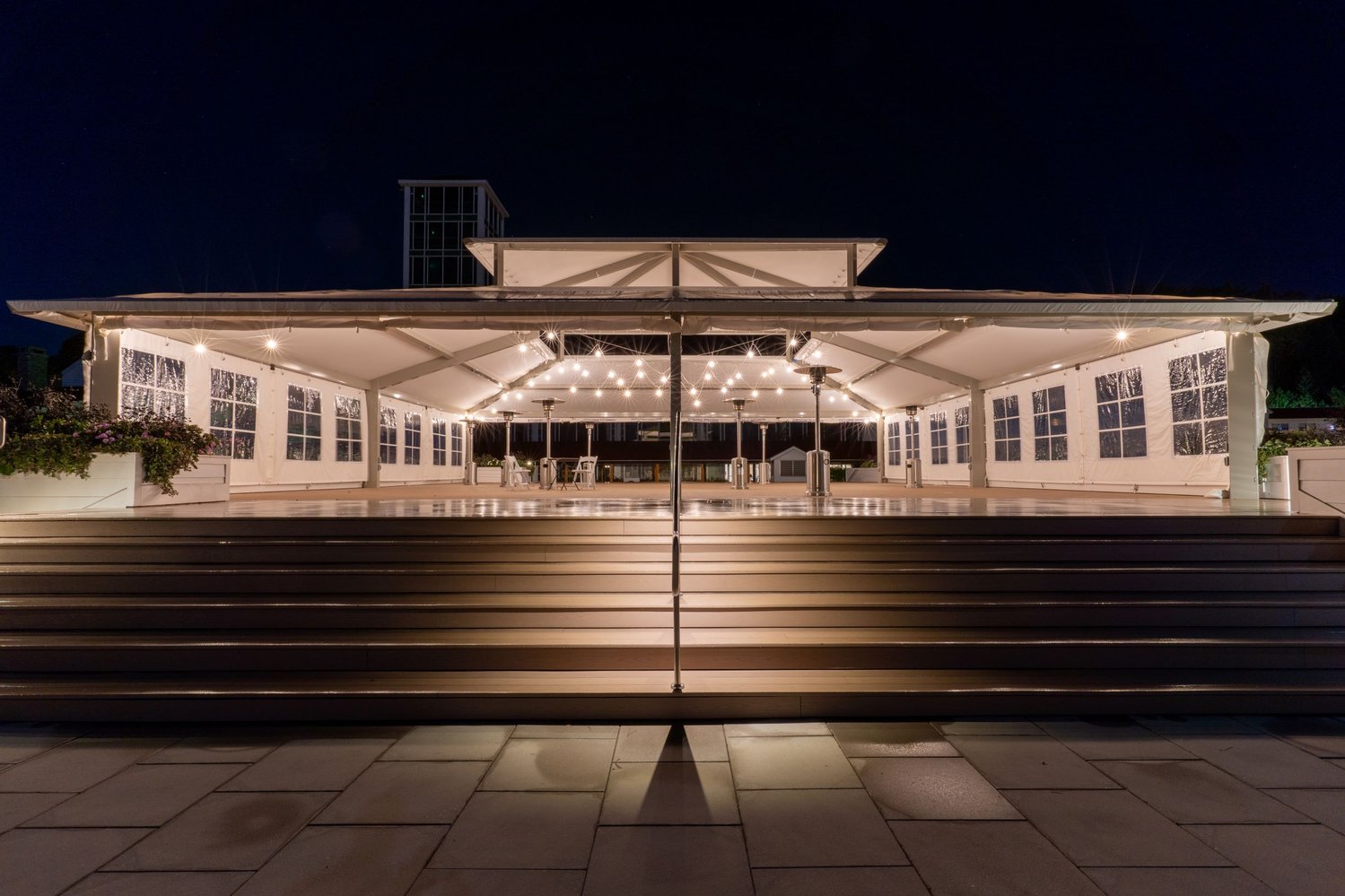 Promenade Shelter during sundown with light shining throughout the shelter